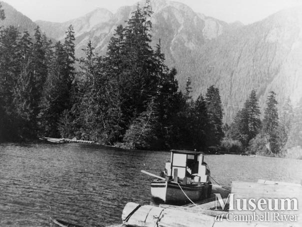 In front of Ellingsen's logging camp at Phillip's Arm