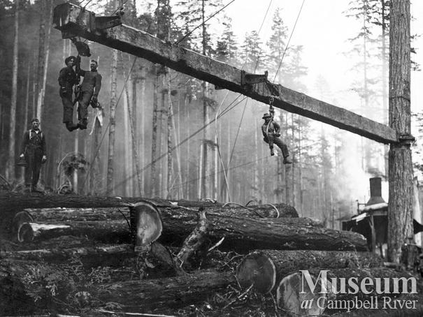 Loggers on loading boom at Elk Bay