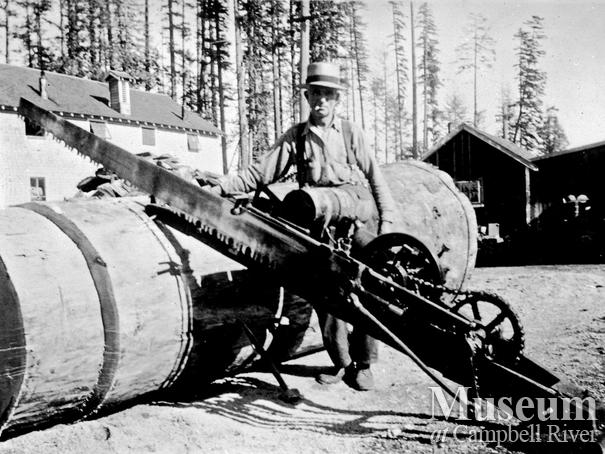 Cutting firewood at Elk River Timber Camp 6