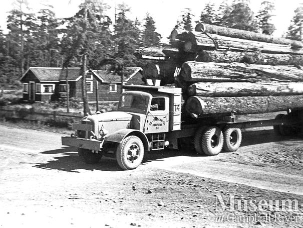 Loaded logging trucks at Oyster Bay