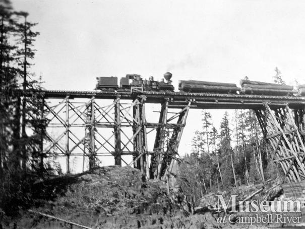 Locomotive on logging railroad trestle