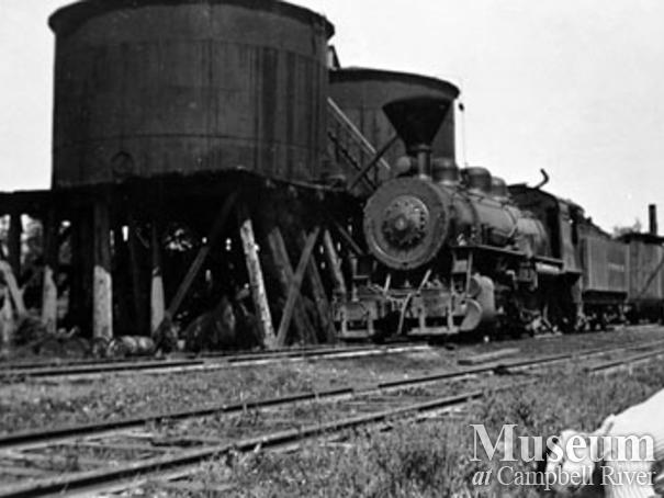 Elk River Timber Co. locomotive beside fuel tanks