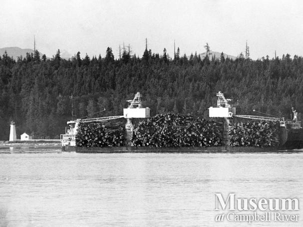 Self-propelled, self-dumping log barge